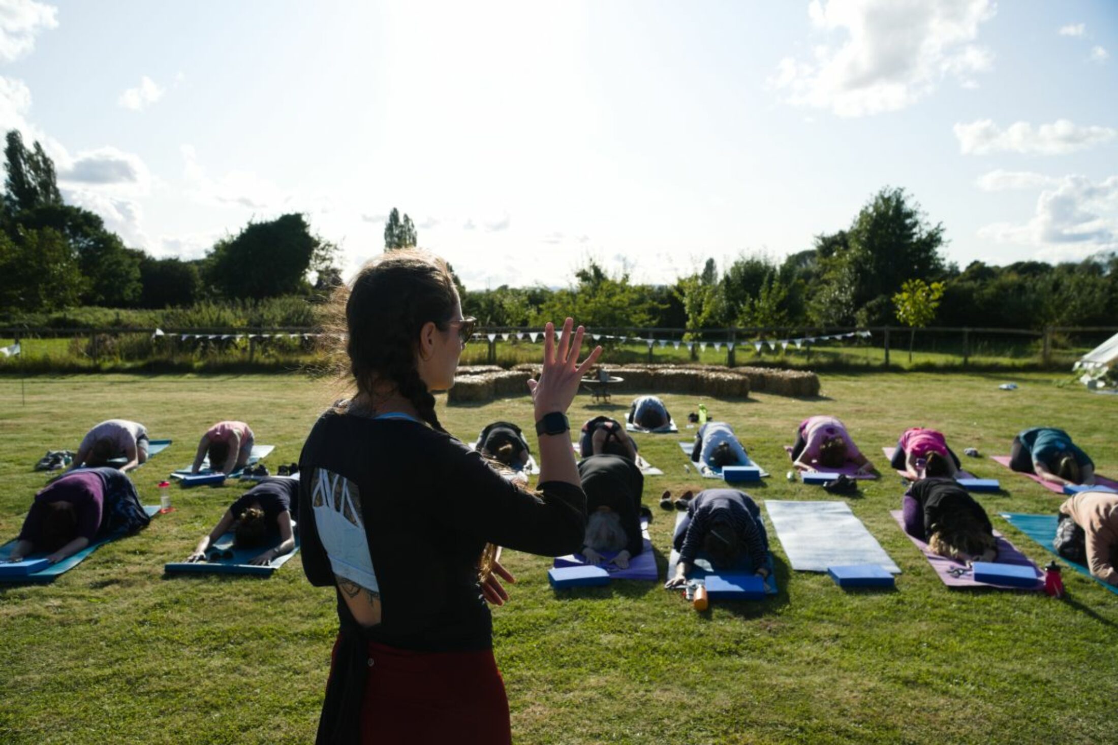 Bethaney Mouzer leading a sign language yoga class before lockdown